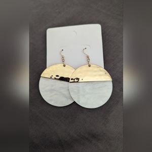 White and gold tone earrings